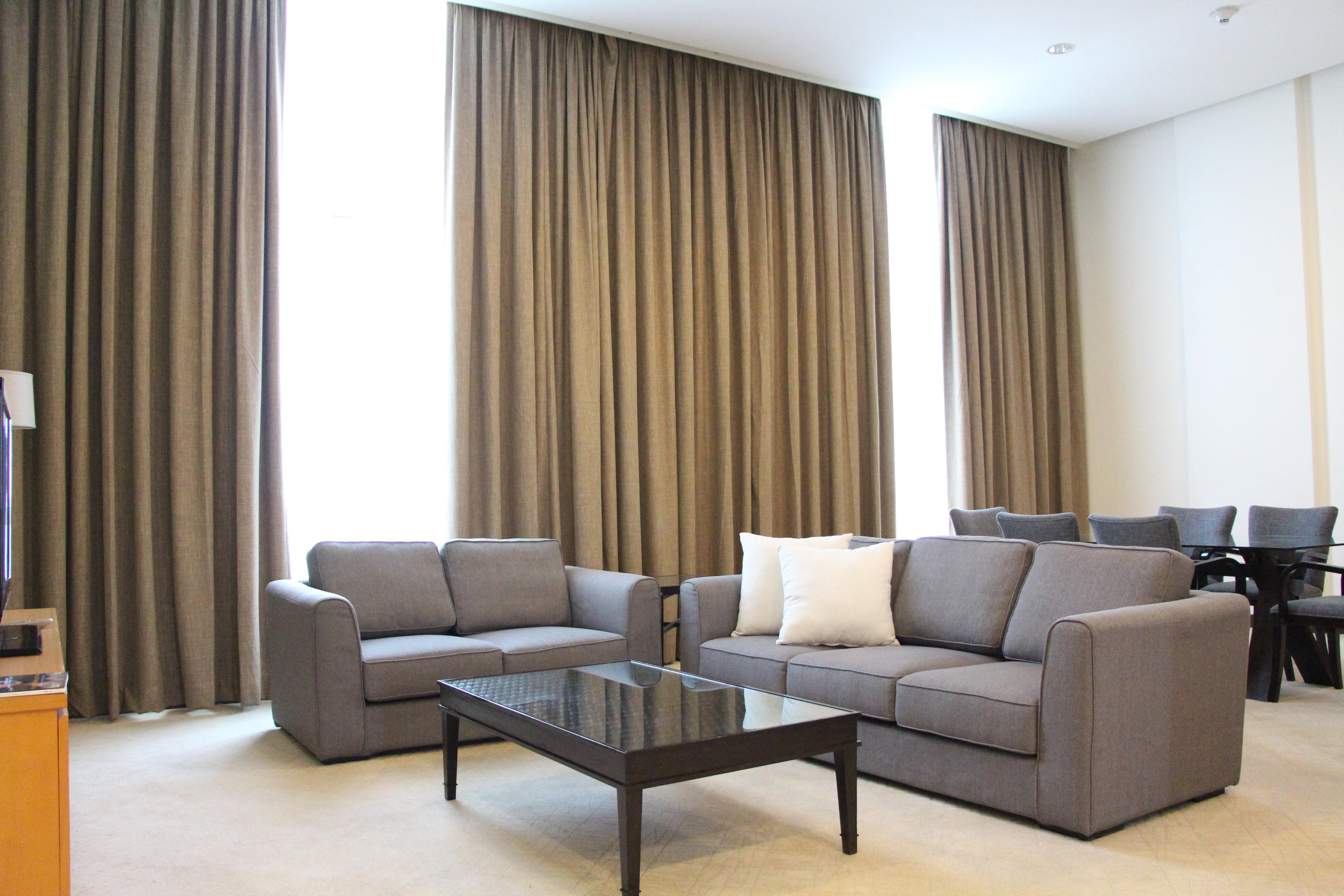Holiday Inn Melaka By Ihg Exterior photo A living room with curtains