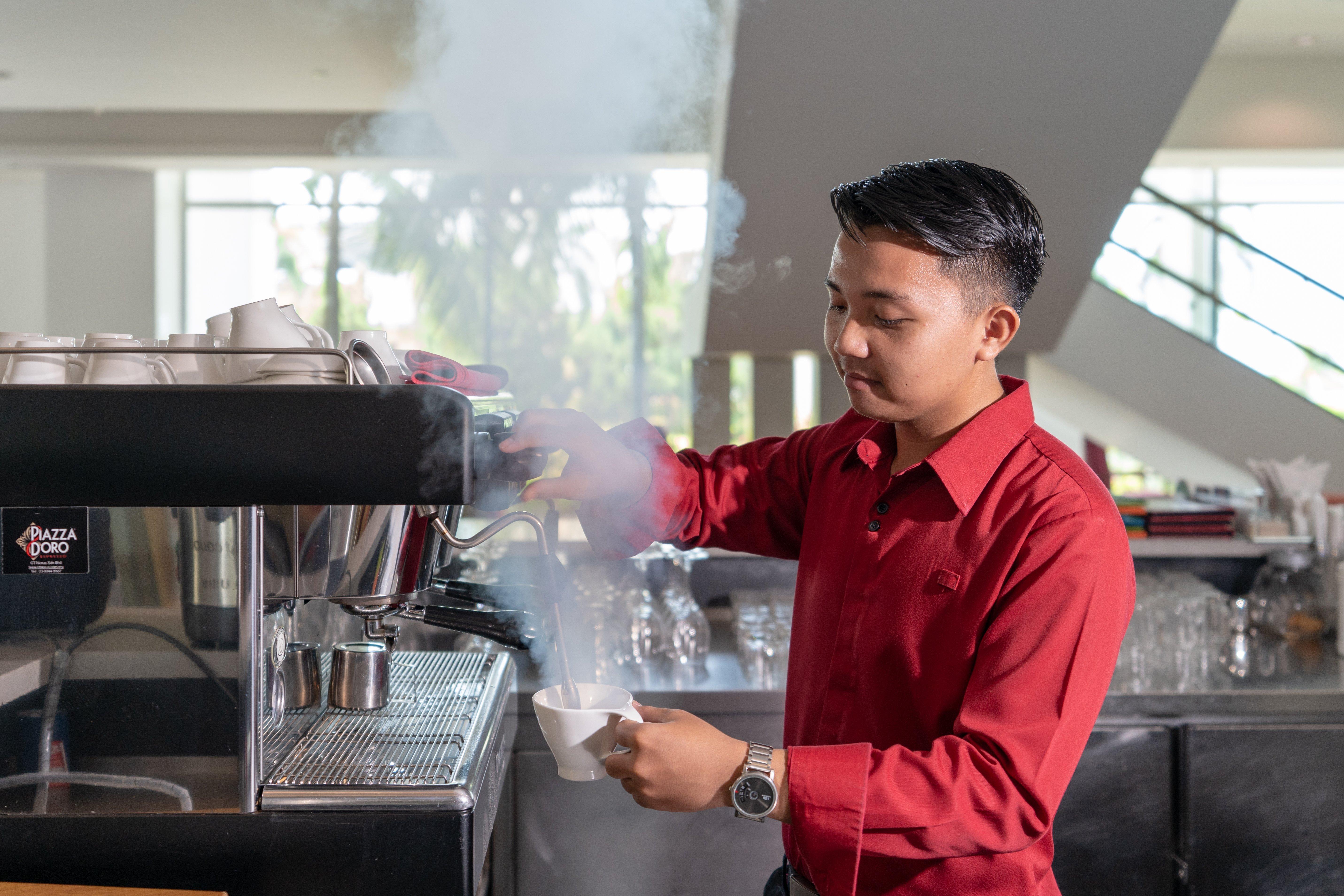 Holiday Inn Melaka By Ihg Exterior photo A barista at work